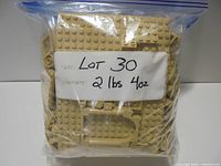 Bag of tan LEGO bricks with label indicating lot weight