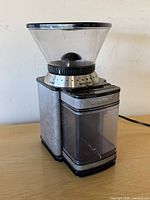 Front angled view of Cuisinart burr coffee grinder showing hopper, grind selector and grounds bin