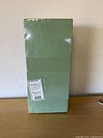 Front view of sealed pack showing six green foam bricks and FloraCraft label