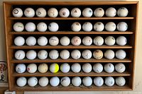 Front view of rack fully populated with golf balls