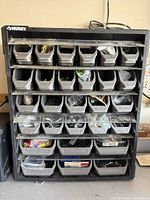 Front view of Husky rack with 24 bins and contents