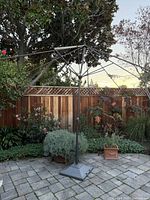 Full view of umbrella frame without canopy in patio setting