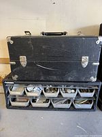 Organizer with black case stacked on top showing overall lot