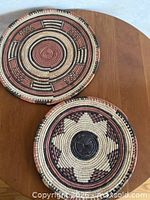 Both flat woven baskets on tabletop