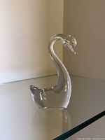 Front angled view of clear glass swan figurine