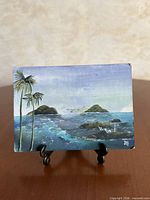 Front view of painting on easel