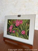Full view of framed tulip artwork on wooden stand