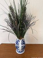 Vase with artificial stems, full view
