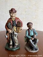 Both figurines side by side showing overall condition and size relation