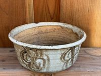 planter pot side view showing butterfly motif