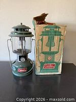 Lantern beside original box, showing overall condition and matching graphics