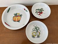 All three vegetable motif bowls front view