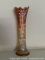 Full view of marigold carnival glass vase