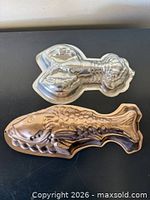 Both molds showing fish and lobster shapes