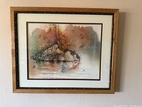 Full view of framed artwork on wall