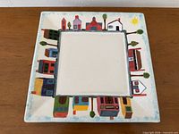 Full view of square plate showing entire hand-painted house border