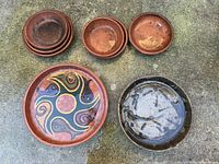 Full lot showing all eight bowls and dishes on ground
