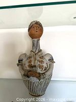 Full view of figural stoneware decanter pitcher