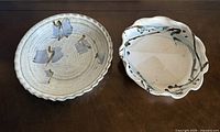 Both shallow stoneware bowls side by side showing size, rims, and interior designs