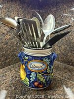 Front view of crock and utensils