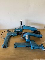 All tools, charger and battery on table