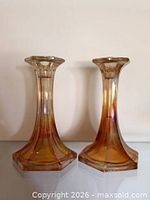 Front view of both glass candlestick holders