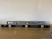 Two spirit levels on surface