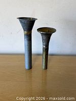 Front view of both metal candlestick holders