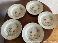 Five Mikasa Margaux plates on table