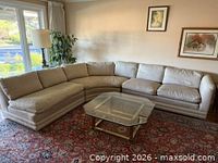Full view of sectional sofa showing all three connected pieces and cushions