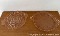 Both pink Depression glass platters side by side for size and pattern comparison