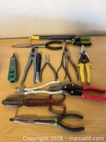 All thirteen tools laid out on table