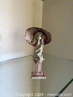 Front view of porcelain lady bust on pedestal