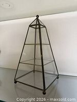 Front three-quarter view showing full pyramid curio cabinet