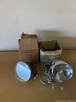 Sebring mirror and Hawthorne horn-headlight with boxes on tabletop