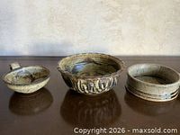 Three stoneware pieces displayed front view