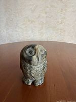 Front view of carved stone owl figurine