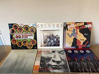 All six album covers laid out for identification