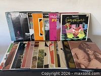 Front view of entire group of vinyl records showing two rows of album covers