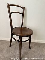 Front angled view of wooden bistro chair showing overall design