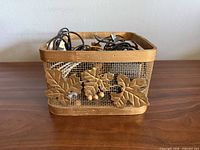 Front view of decorative basket filled with cords