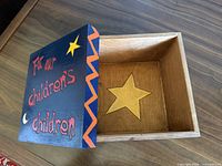 Box open showing interior inlaid star