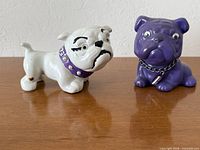 Front view of both bulldog figurines