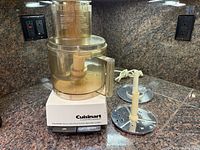 Full view of Cuisinart food processor base, bowl, two discs with stems and power cord