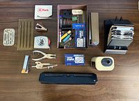 Overall lot layout on table showing all vintage office items