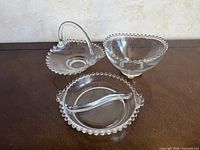 Three Candlewick glass pieces grouped