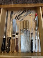 drawer view of all knives, cleavers, utensils and small tools