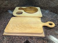 Three wooden cutting boards arranged on countertop