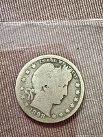 Obverse of 1898-O Barber quarter showing Liberty head and date