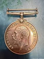 Obverse of medal showing King George V profile and inscription